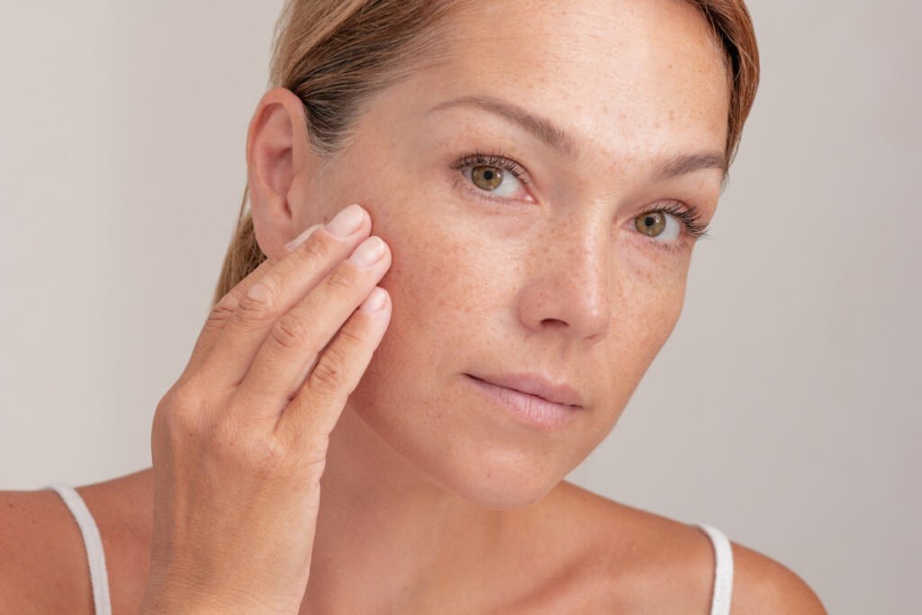 Woman touching face to lift the cheek and skin