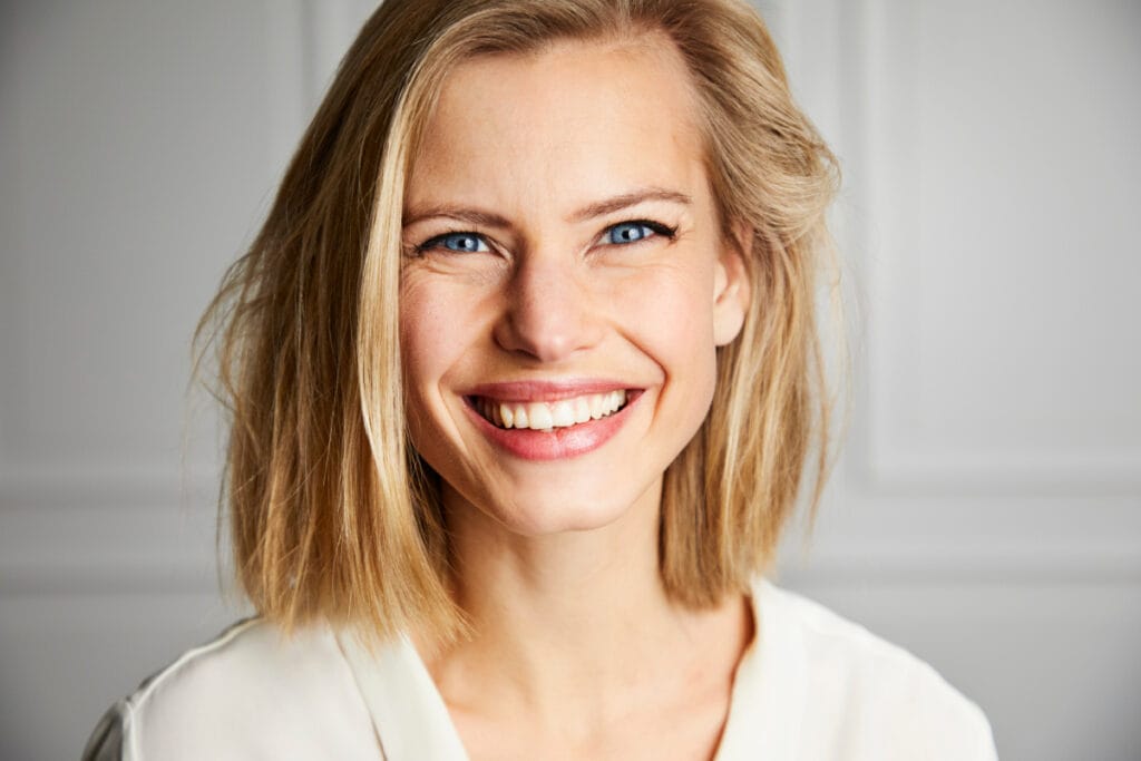 Close up of blonde woman smiling